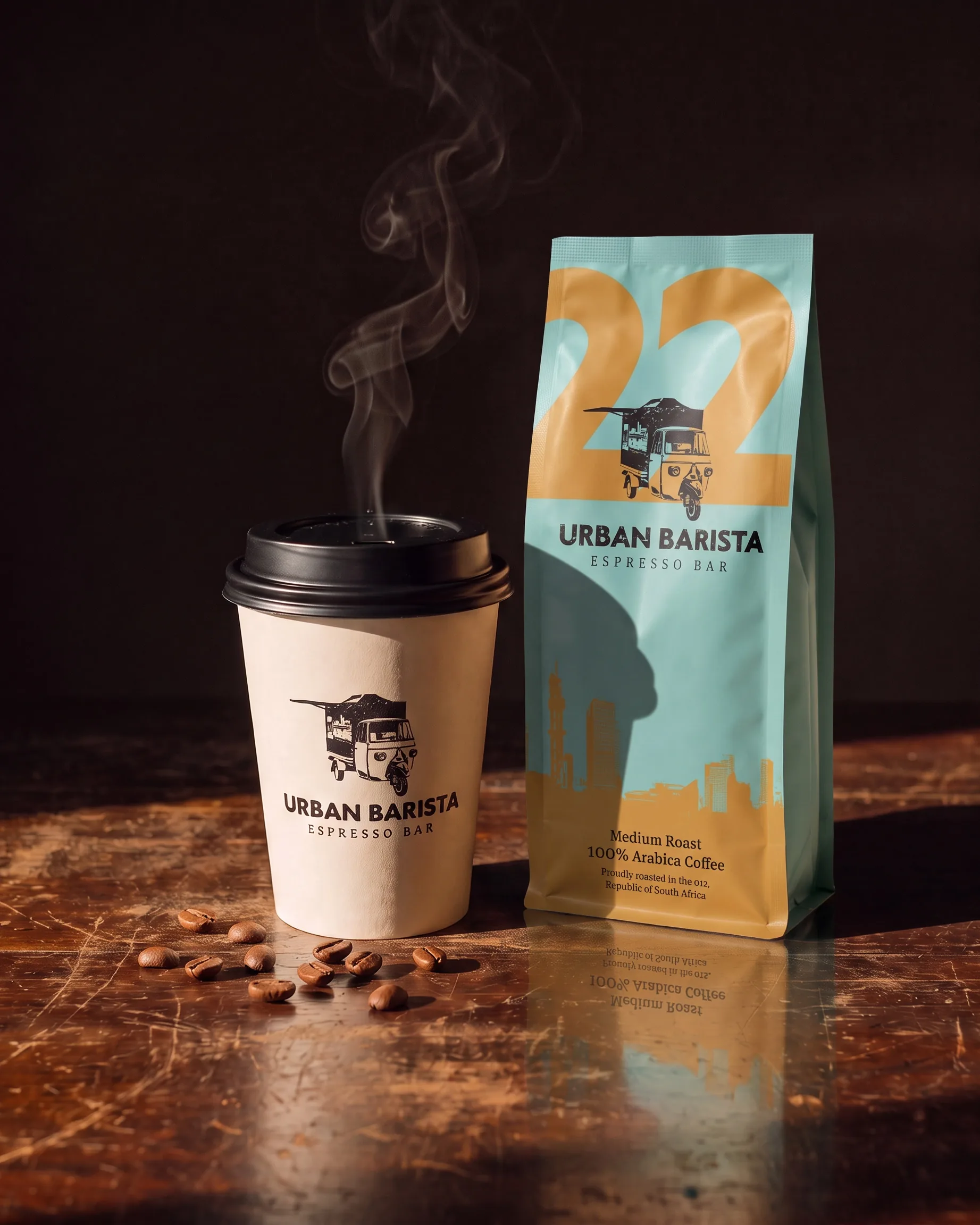A steaming takeaway cup with the Urban Barista logo beside a Medium Roast bag numbered 22, coffee beans on the counter.