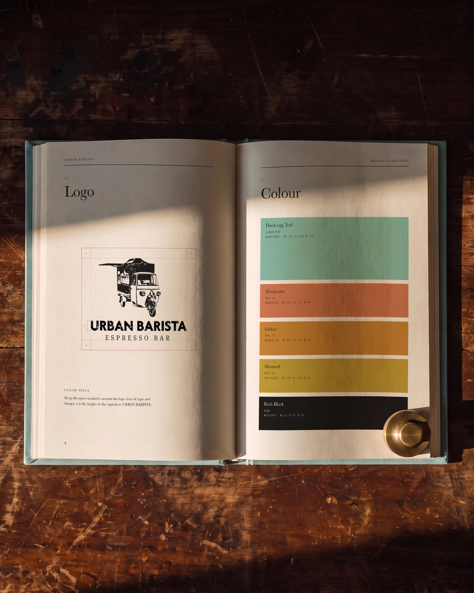 Urban Barista’s brand guidelines open at Logo and Colour: the logo with its clear space marked, facing five colour swatches.