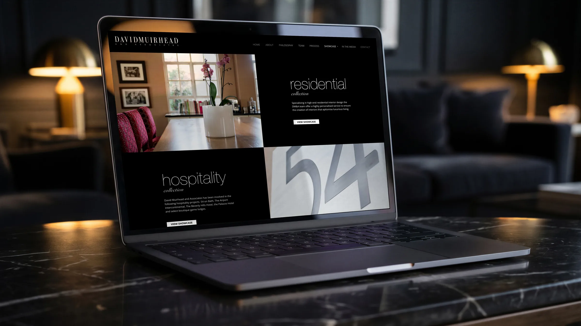 The website’s Apartment Living page: the kitchen, a dining table with an orchid and the living room, more rooms in a strip below.