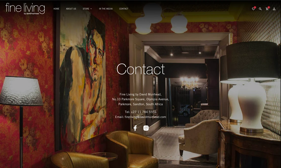 The contact page: the Parkmore showroom’s painting and velvet chairs behind the address.