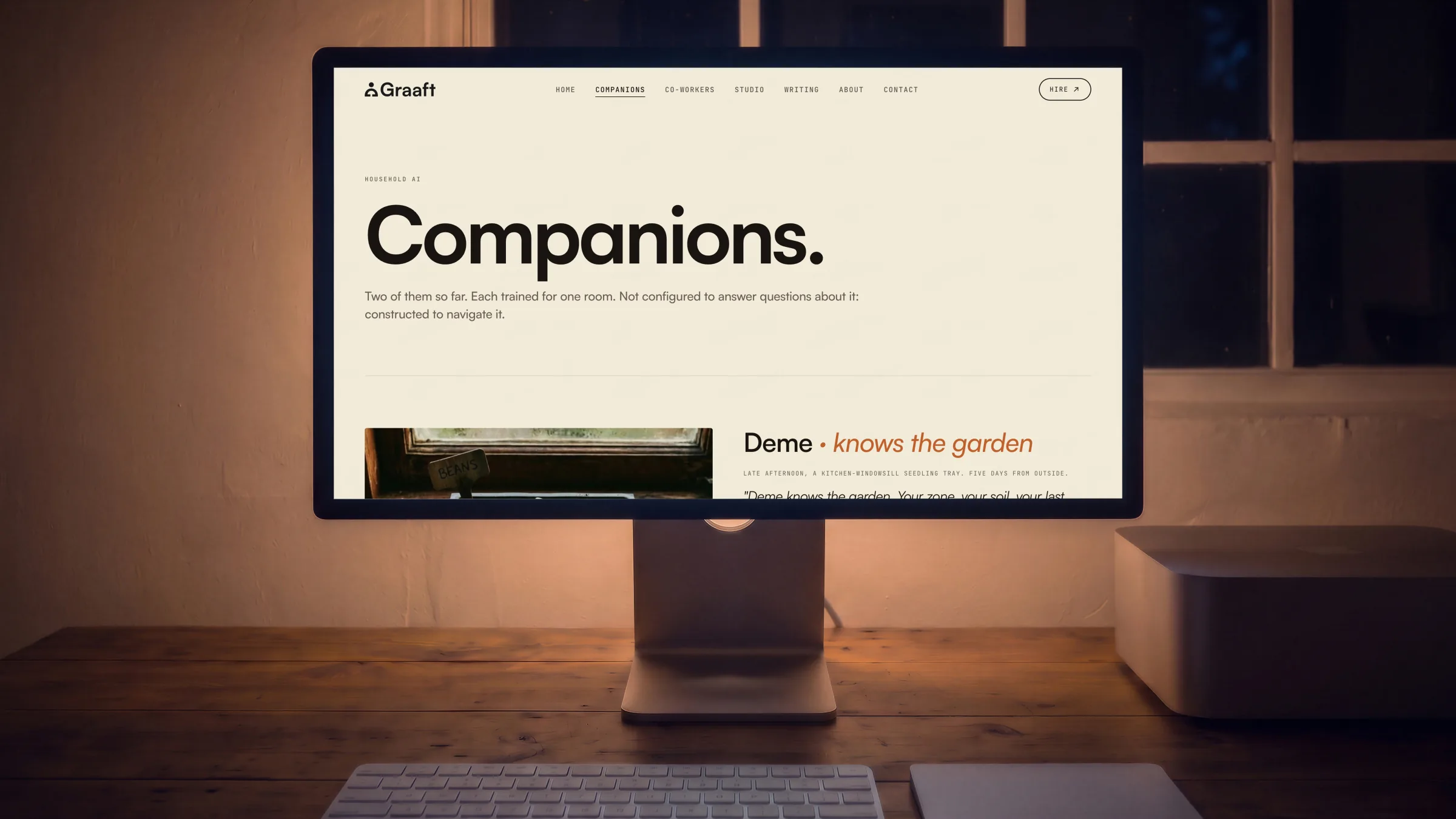 A large display square on, on a timber desk at night, the Companions page on its screen.
