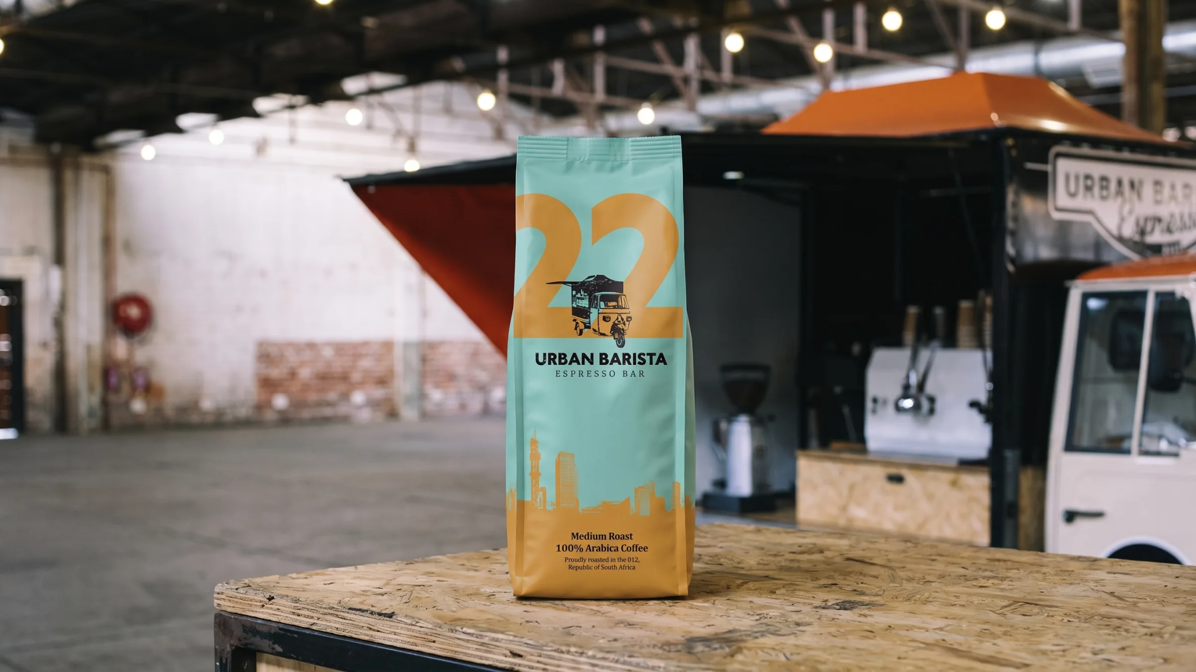 The three bags on the espresso cart’s counter, the machine and grinder behind.
