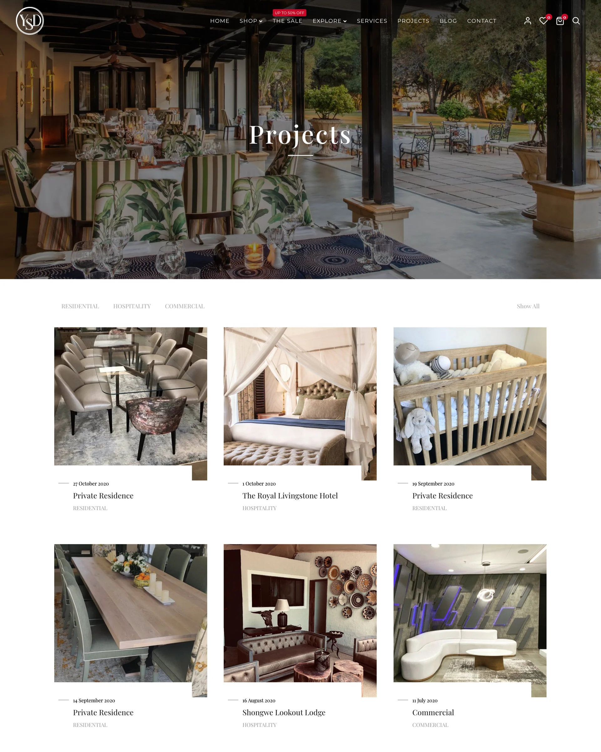 The shop on a phone on marble: sofas on white, yellow View Product buttons.